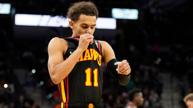Atlanta Hawks guard Trae Young (11) kisses his uniform before the game against the San Antonio Spurs at AT&T Center.